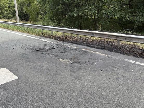 Verontreiniging door een brandend voertuig.
