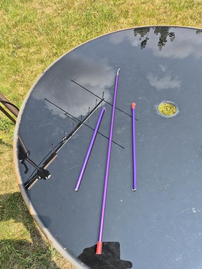 3 violet aluminium Arrow II antenna elements,  the centre one being the longest (with visibly bent screw in) and the 2 side ones being shorter and visibly snapped parts.