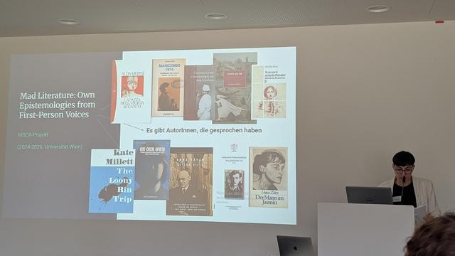 Sara R Gallardo in front of her presentation