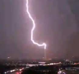 Image of the Washington monument being struck by lightning in June of 2020.