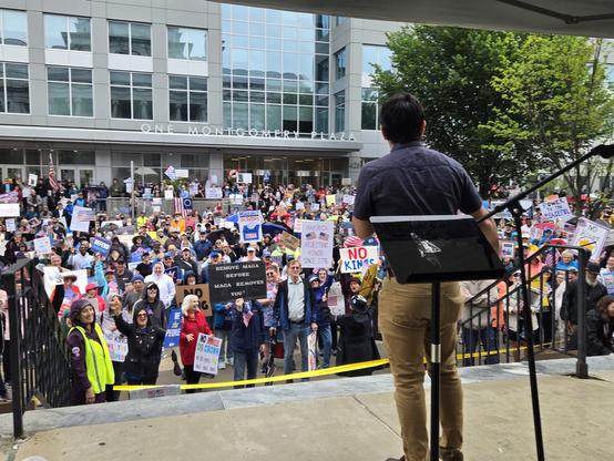 Picture of protesters at Norristown/Montgomery County, PA protest rally with chair of county commissioners speaking in the foreground.