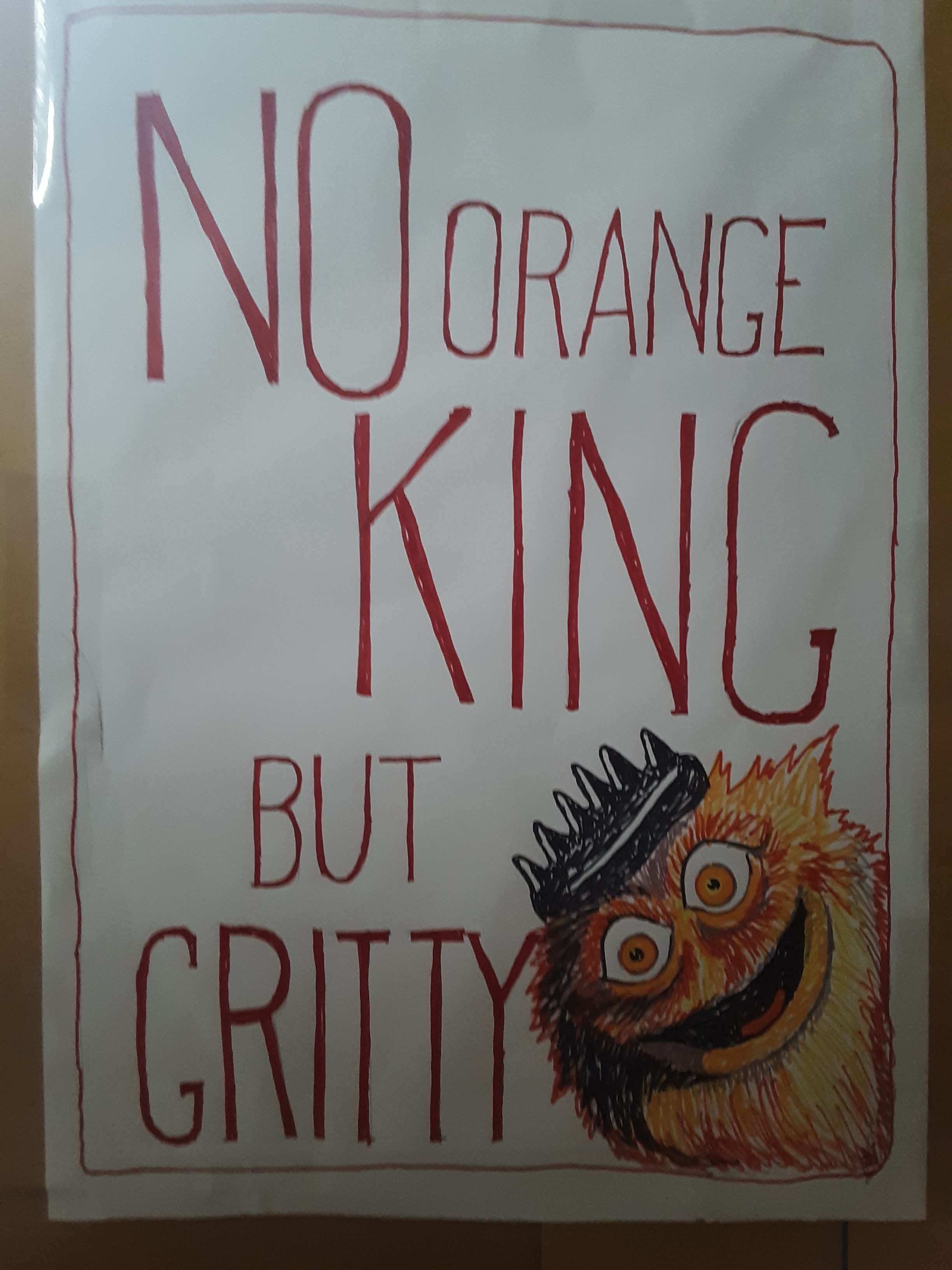 Text on my sign: No orange king but Gritty! Image: drawing of Gritty peeking out. Instead of his usual helmet he has a shiny black crown.