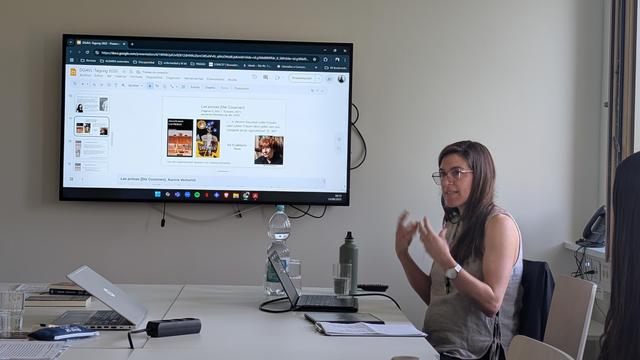 Malena Pastoriza in front of her presentation