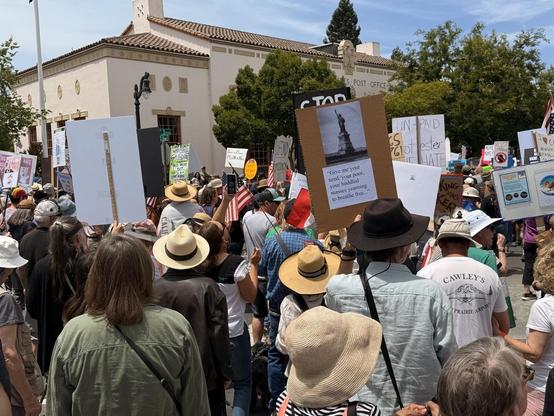 Hundreds of protesters march past the US post office in Petaluma California