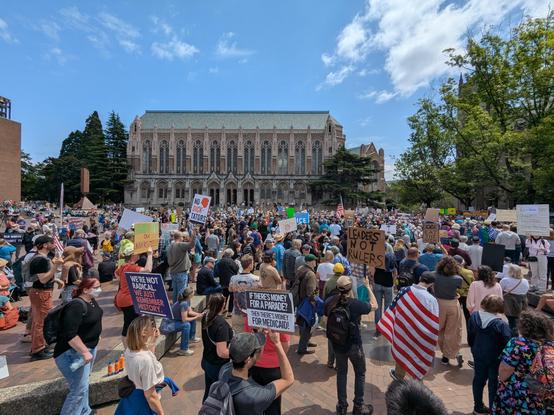 A photo of a large crowd of protesters at UW's Red Square