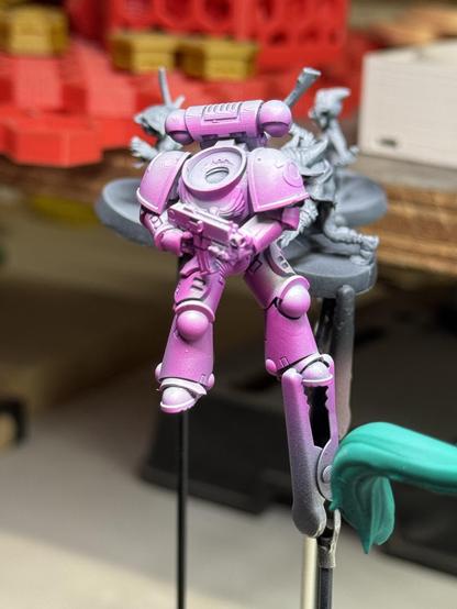 The third space marine body with pink shadows sprayed in. This will be the underlayer for the yellow ink coming next.