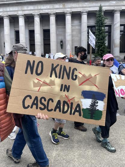 A sign a the WA Capitol that says “No king in Cascadia.”