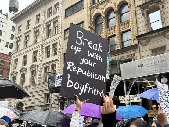 Handmade sign: “Break up with your Republican boyfriend.”