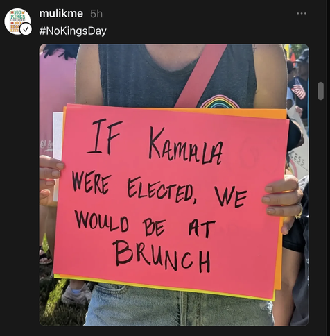 Protester with sign: "If Kamala were elected we'd be at brunch now."