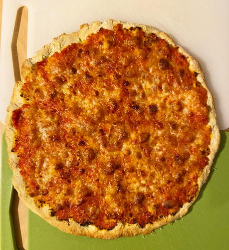 On a chopping board in my kitchen, waiting to be sliced, a plate-sized homemade cheese-and-tomato pizza - not a margherita, I didn't have any basil leaves - fresh out of the oven.

And it's definitely a pizza. Not a pie.
