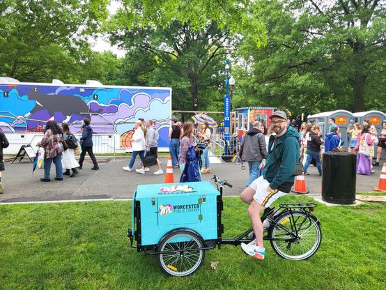 Photo of a cargo bike with livery for the Public Library of Worcester, MA taken on the Boston Common