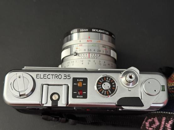 Yashica electro 35 from the top, showing focus and aperture rings as well as the ISO/ASA dial, rewind crank, winding lever and shutter button