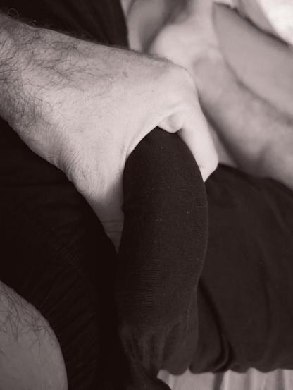 My erection in hand, still sleeping trousers around it