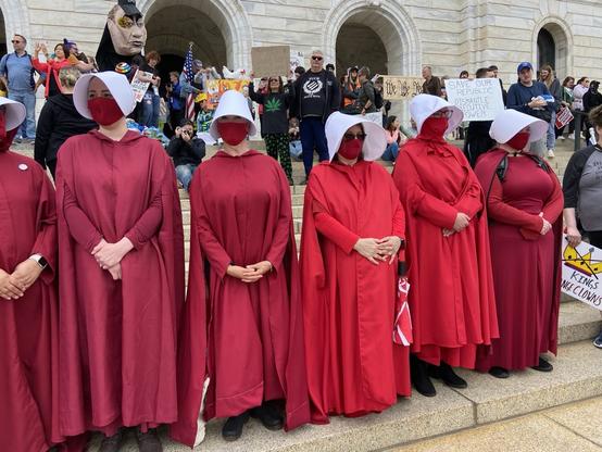 A gathering of women dressed as handmaids, a la “The Handmaid’s Tale” on the steps of Minnesota’s Capitol