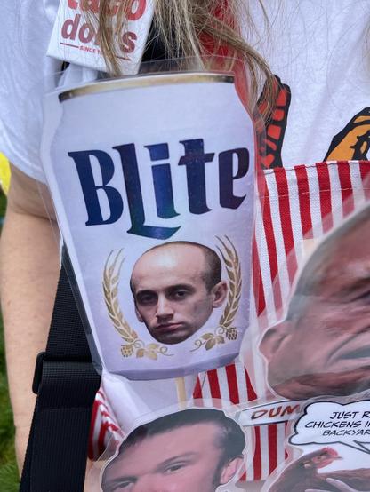 Close up view of a beer can on a stick, with image of Stephen Miller. The beer label is BLite