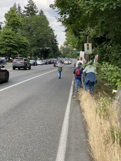 protest crowd getting into Bothell Way a little