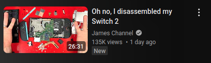 youtube video titled "Oh no, I disassembled my Switch 2" and the thumbnail is a nintendo switch 2's internals all around a red desk