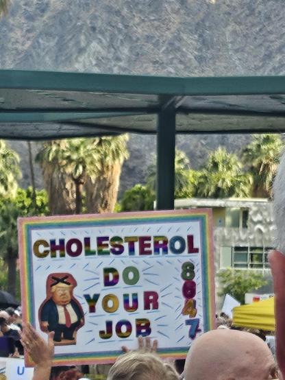 Sign I liked. Has a cartoon picture of Trump bottom left. Text says "Cholesterol Do Your Job" On right side: "8647"