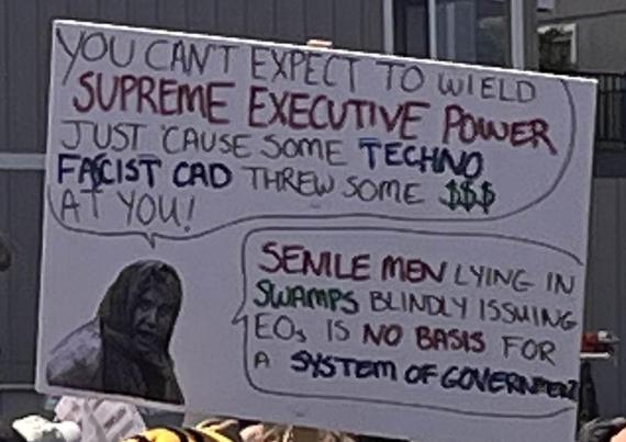 Picture of character from Monty Python and the Holy Grail and hand-written text: "You can't expect to wield supreme executive power, just 'cause some techno fascist cad threw some $$$ at you!

"Senile men lying in swamps blindly issuing EOs is no basis for a system of government."