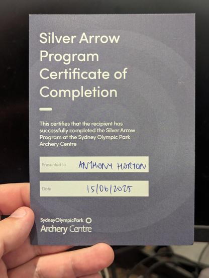 Photo of a piece of card with "Silver Arrow Program Certificate of Completion" printed on it.