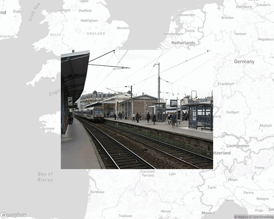 A photo of or from a train station from the linked website, overlaid on a cropped world map where it's located.
