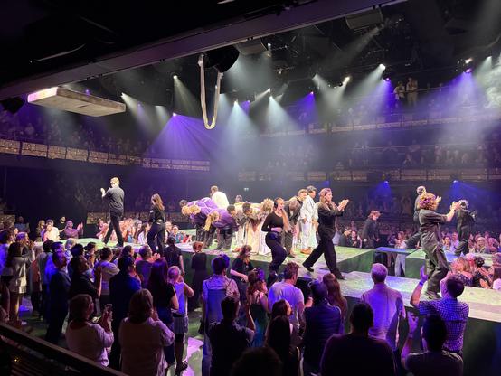 The cast and crew on stage for bows at the end of the performance.