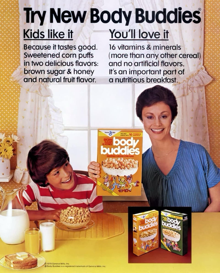 A young man eats a bowl of cereal while looking up at his mother holding the box. In the background is a large window with light flooding in.
