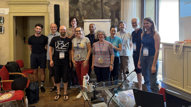 (left to right): Stefano di Grigoris, Sebastian Rudolf, Heiko Paulheim Aidan Hogan, Irene Celino, John Domingue, Claudia d'Amato, Valentina Presutti, Ian Christoph Kalo, Harald Sack, and Lise Stork at the end of ISWS 2025, standing lined up in the Fresco Room of Bertinoro Castle