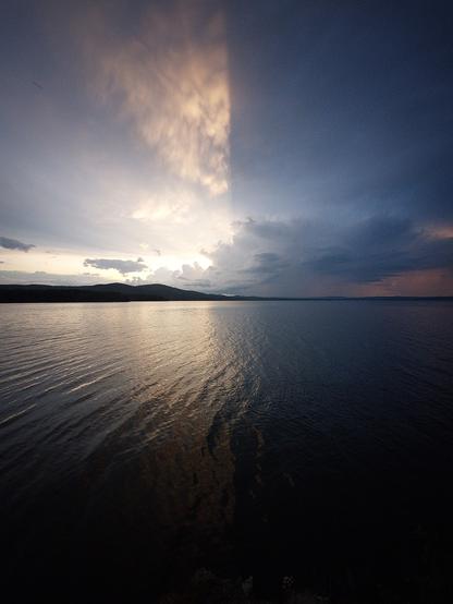 Sunset on the lake, a thunderstorm is approaching