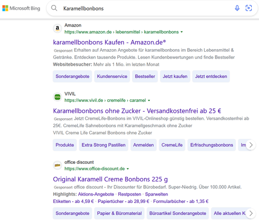 Microsoft Bing search engine result page for "Karamellbonbons" (caramel candy). Three ads are shown with each having several sitelinks with a blue background.