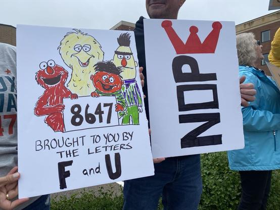 Protest signs 8647 brought to you by the letters F & U, with sesame street characters. 

Nope & the E is a crown.