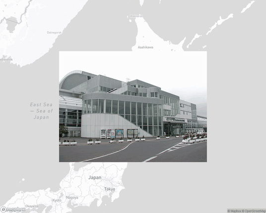 A photo of or from a train station from the linked website, overlaid on a cropped world map where it's located.