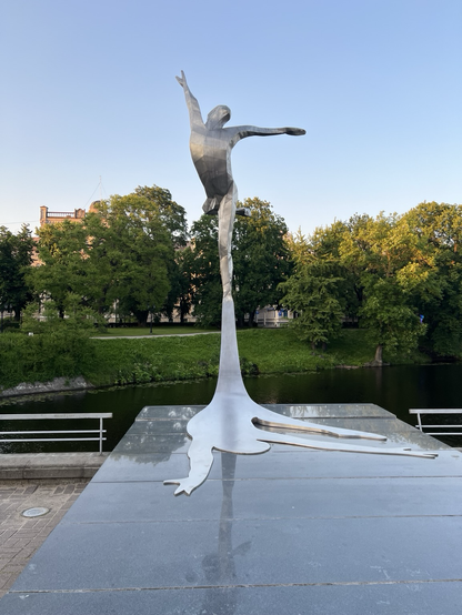 A metallic sculpture of a dancer, near the Riga opera