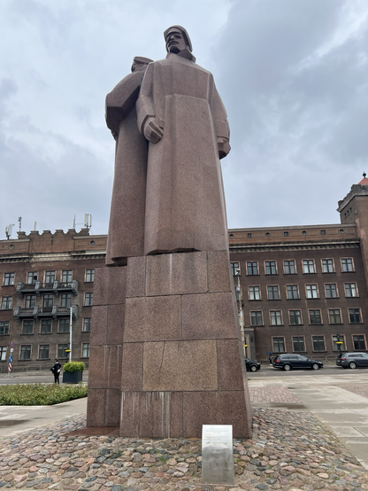 A memorial to the Riga riflemen: a pinkish granite looking sculpture of some stern looking men