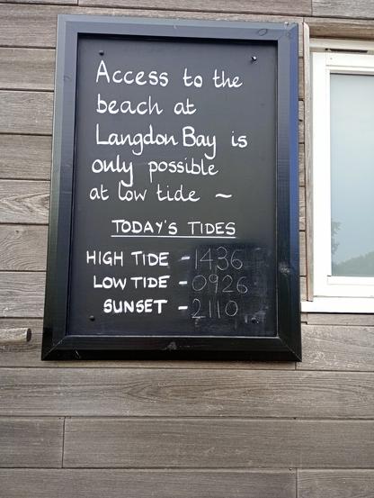 Blackboard sign about tides at Dover