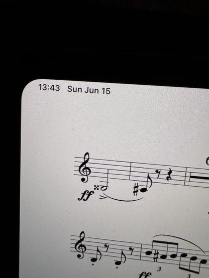 Picture of a piece of music. The goes note is a half note, and the pitch is G double sharp below the treble clef.