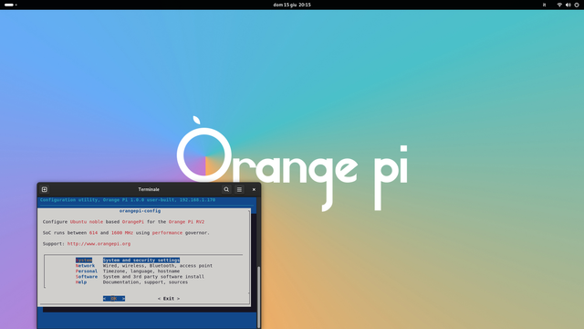 The image displays a computer screen with a gradient background transitioning from blue to green to orange. Prominently featured is the text "Orange pi" in white, with a stylized logo resembling an orange. Below the text, there is a terminal window open, showing a command-line interface with the title "Terminal." The terminal window displays a configuration utility for the Orange Pi, specifically for Ubuntu, with the version "orangepi-config 1.0-1ubuntu1." The terminal window includes options for system and security settings, personalization, timezone, language, hostname, access point, system install, third-party software, documentation, support, and sources. The time displayed at the top of the screen is "dom 15 g 2013" (Sunday, 15th of January, 2013).