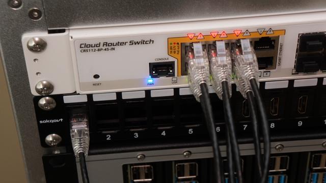 A picture of the Mikrotik CRS112 and the new keystone in the patch panel.