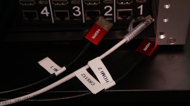 Three cables labeled with flags: two coming from the HDMI outputs of the top two MS-A2s, and the network cable to connect the PiKVM to the network.