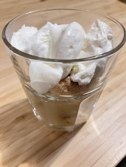 A trifle of apple sauce, macarons, and whipped cream.