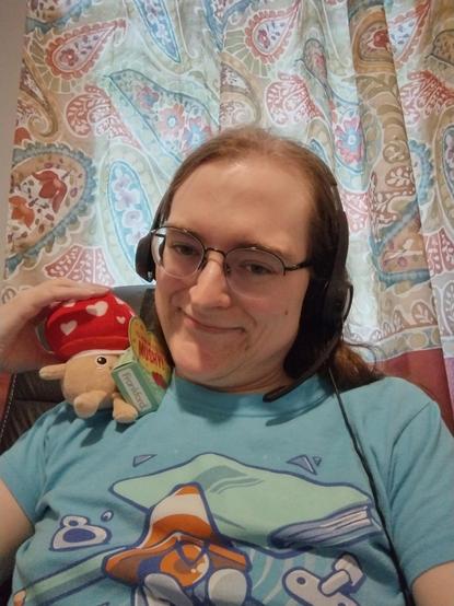 Me, wearing a Traffikrab shirt and holding a small mushroom plushie