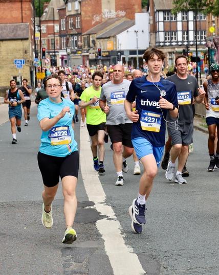 Emily trying to look sprightly running next to a teenager … who looks naturally sprightly.