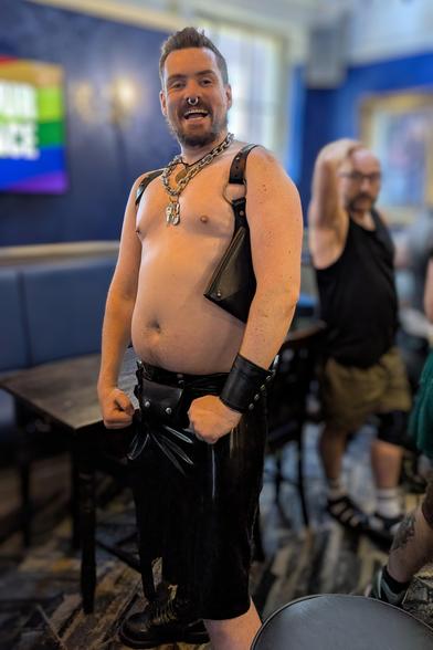 A person wearing a thick Latex Kilt