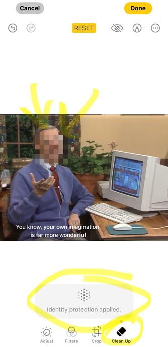 Image screenshot of Mr Rogers in his blue caridgan sitting at a computer. Except. Is it mr rogers? Who knows the face has been security blurred! Yellow arrows point to the effect while a yellow circle highlights the confirmed security blur and in lower right a yellow highlight circles the “cleanup” which is the tool to use to do this.