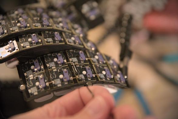 A photo of preparing a wire for soldering to the Dactyl Lynx keyboard.