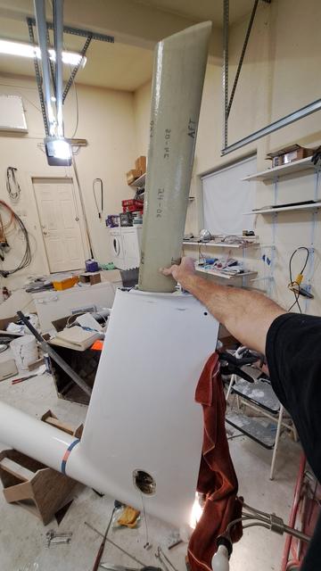 The tail water ballast tank is as tall as the vertical fin, and has an oval cross section. It looks slightly greenish because it's made of fiberglass.