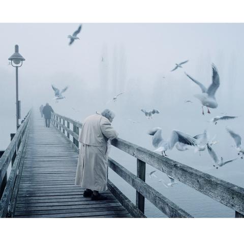 Print - Churchgoers on the bridge to the island form book WERD by photographer Marco Zedler