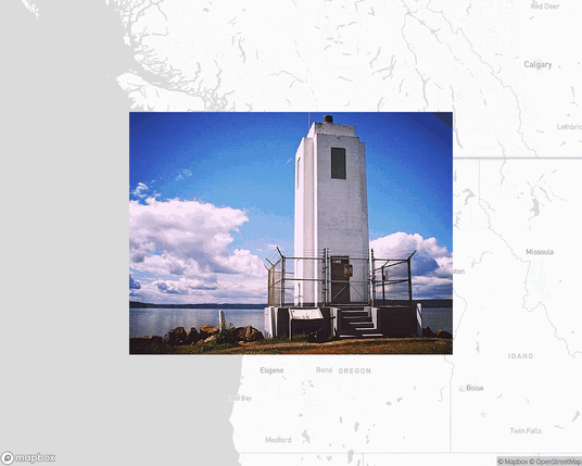 A photo of a lighthouse from the linked website, overlaid on a cropped world map where it's located.