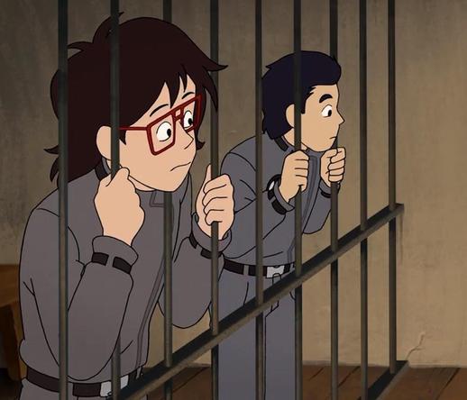 Screenshot from episode 3, The Old West Car. Ryan and Min-Gi are leaning into the bars of their jail cell, focused on something happening offscreen.