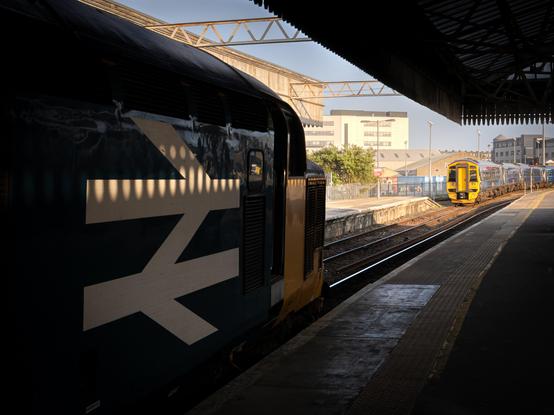 The front end of the Class 37 (37403) looking forward at a ScotRail Class 158 that's also in frame